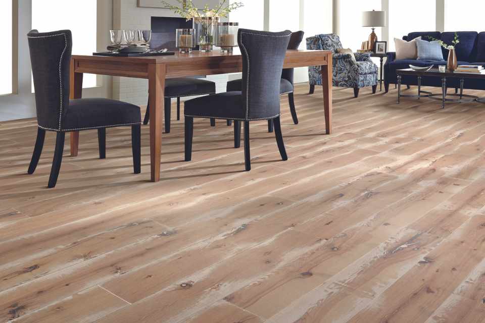 hickory hardwood in dining room with navy blue furniture